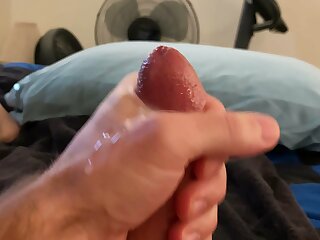 Guy jerks his cock and cums