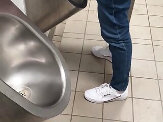 2 guys with nice dicks pissing at a urinal then jacking off and cumming
