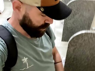 Bearded wanker at urinal